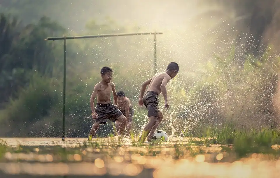 children playing football