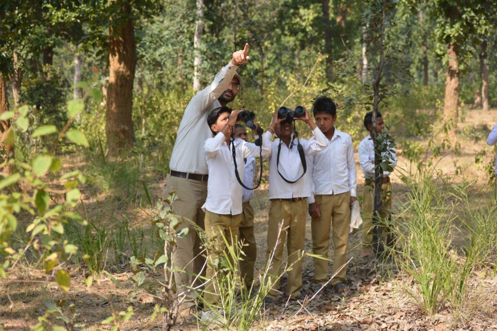 children using binoculars